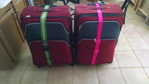 Giant red suitcases before